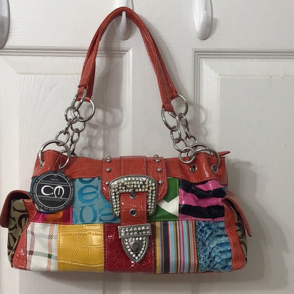 Registered CM trademark purse similar to Coach design. Very colorful.